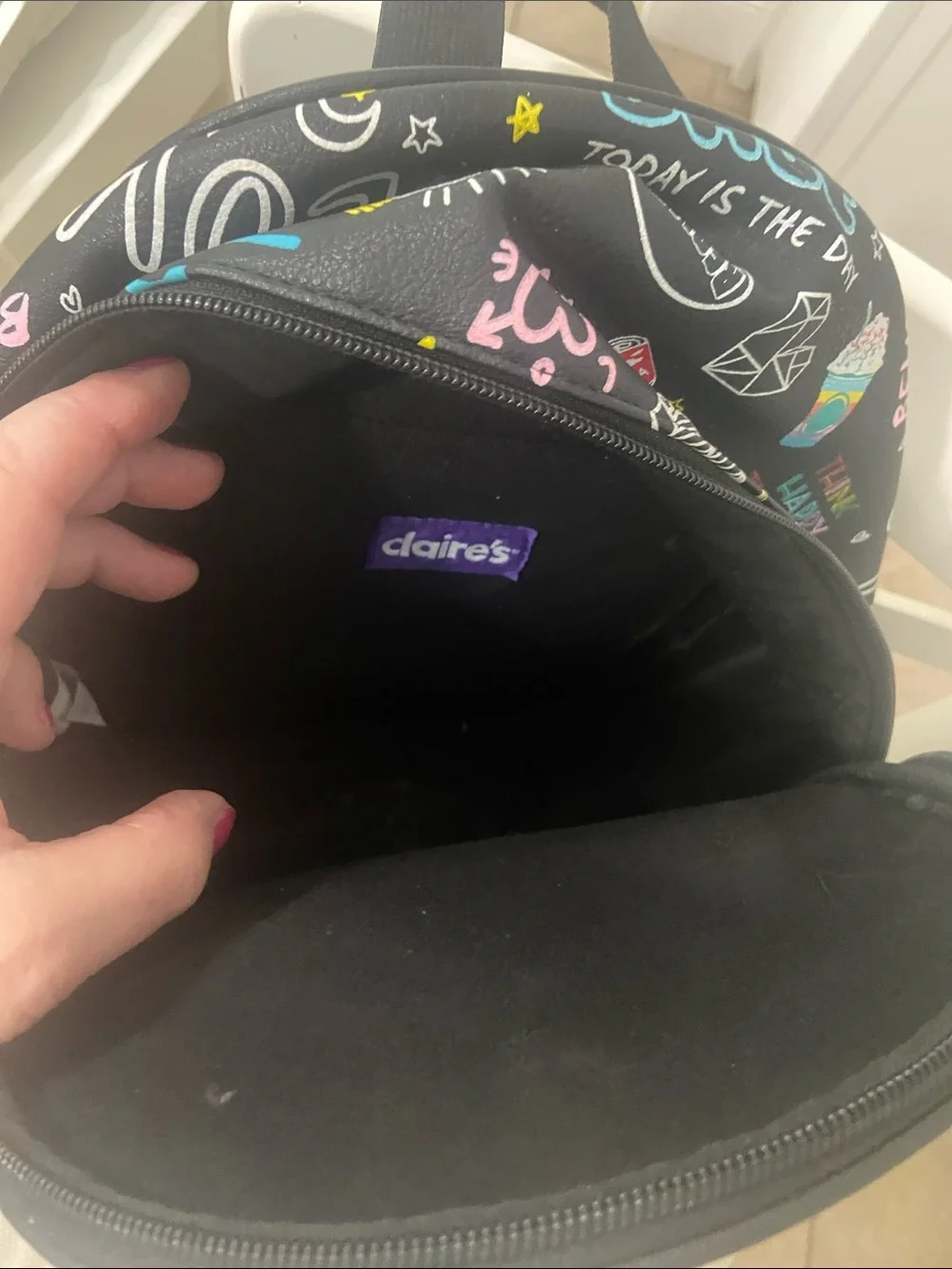 Claire's Black Mini Backpack with Colorful Graphic Icons